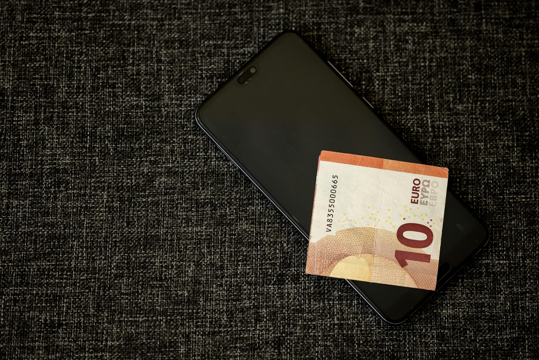 a banknote on a smartphone