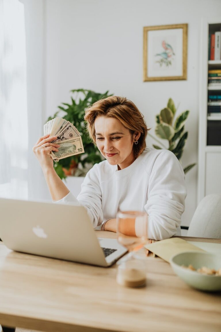 a woman holding dollar bills